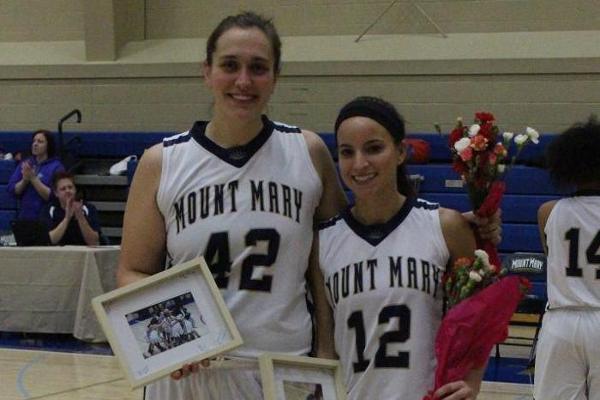 The senior duo of Leverenz (L) and Barker were recognized prior to Tuesday's matchup against Silver Lake.